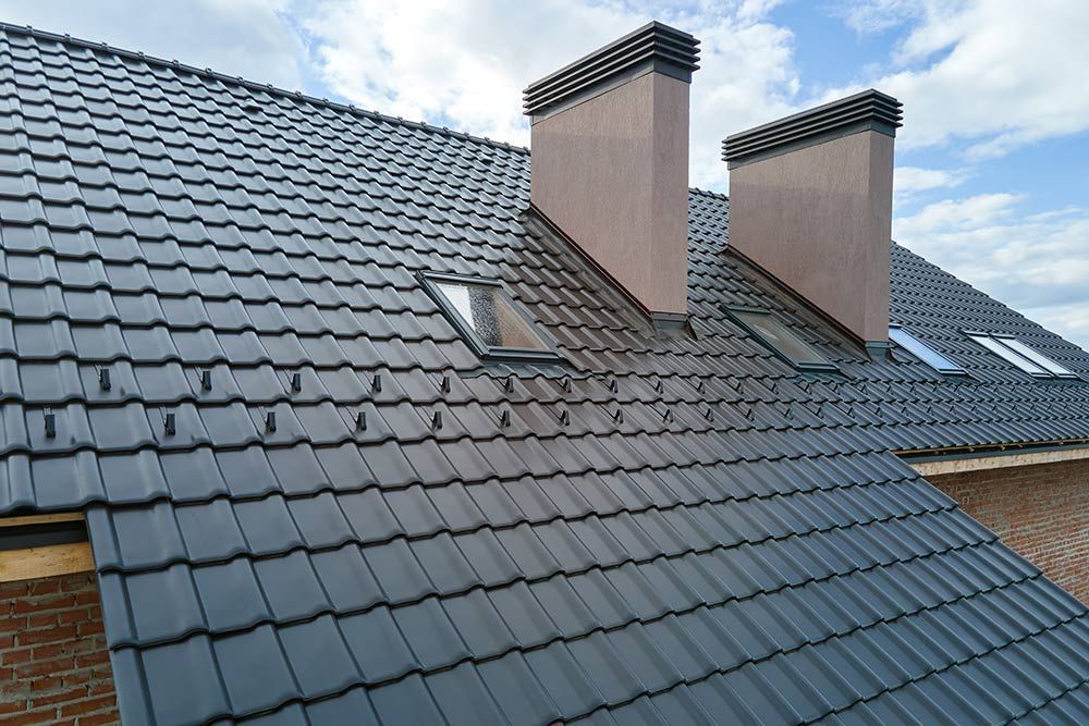 A Roof With a Lot of Tiles and Chimneys on It — Rooftop Northern Rivers In Ballina, NSW