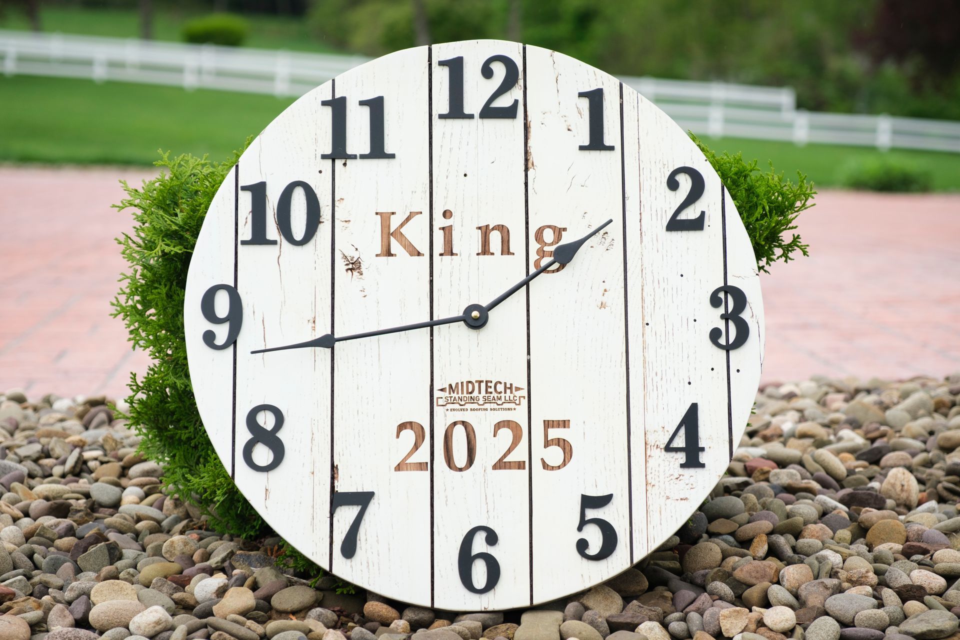 White, rustic clock with black numbers, 