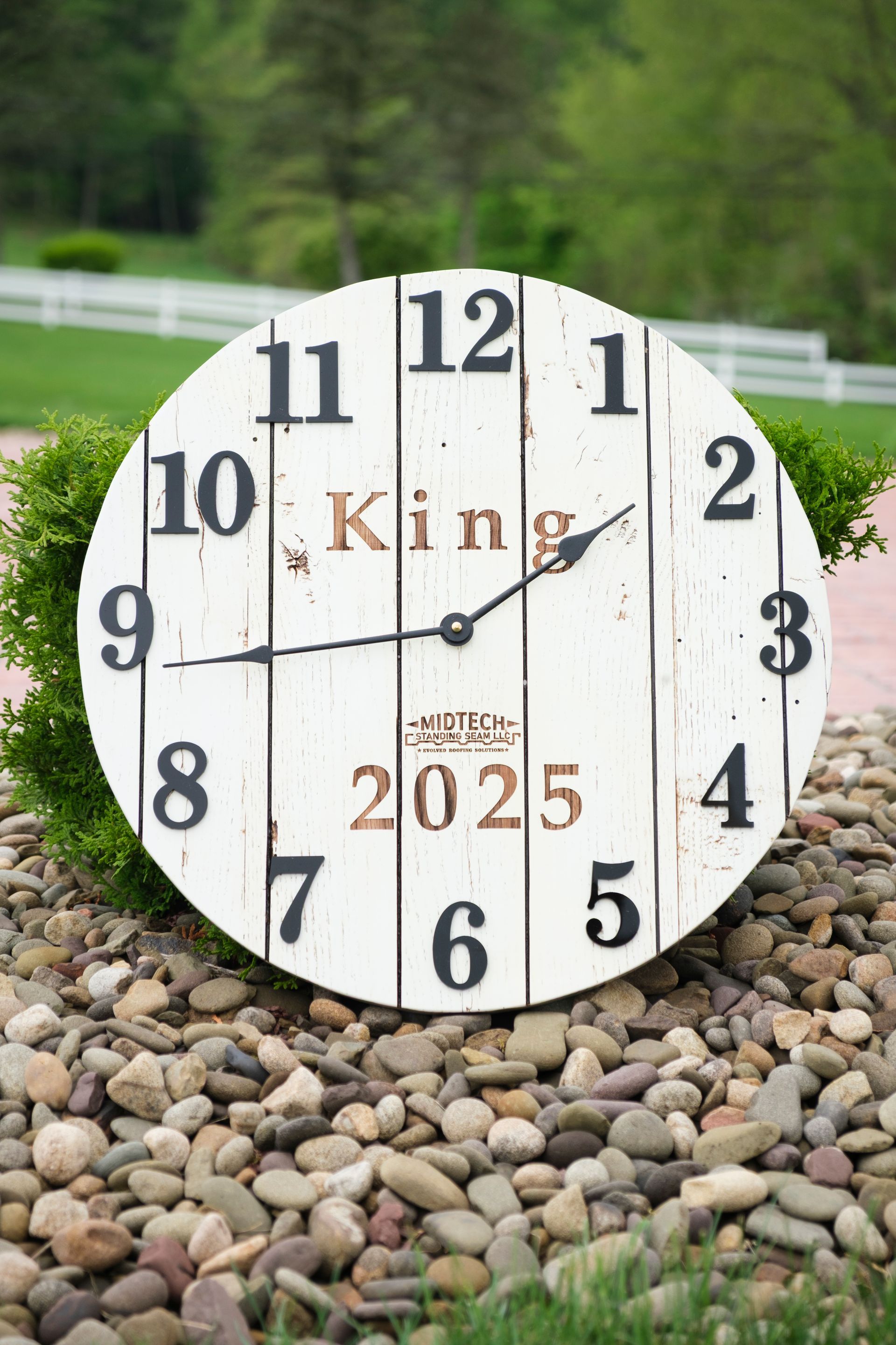 White distressed clock with black numerals, 
