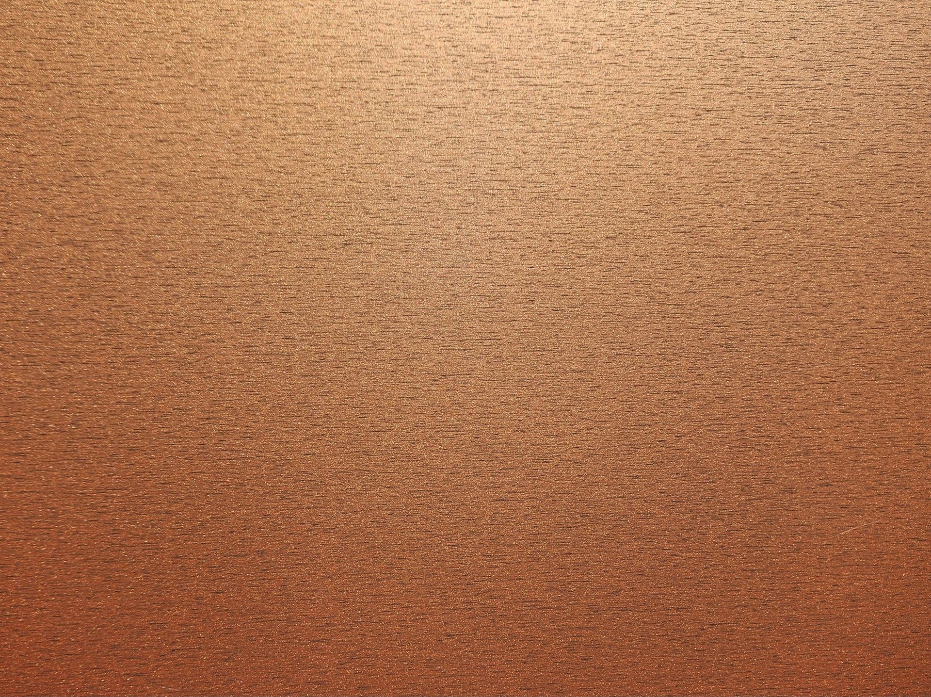 Copper-colored, textured background with horizontal lines.