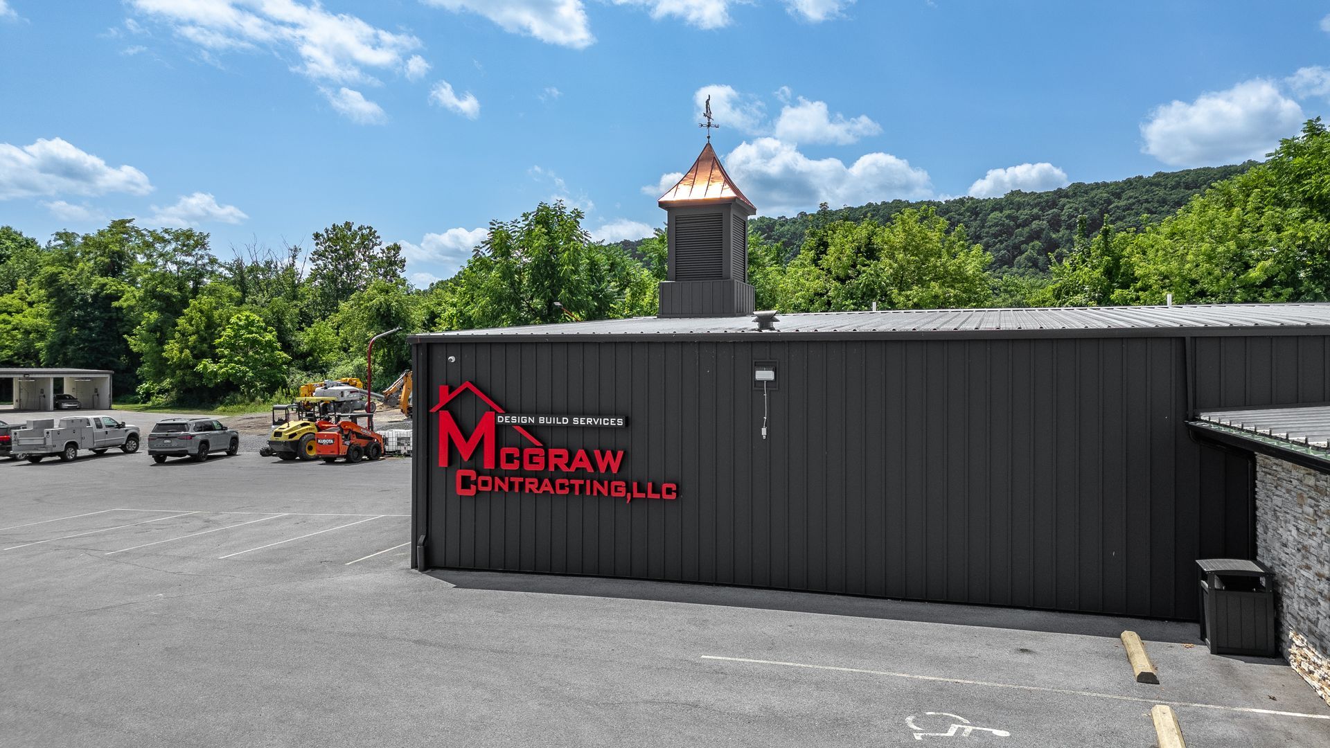 McGraw Distillery building exterior with copper-topped steeple on a sunny day.