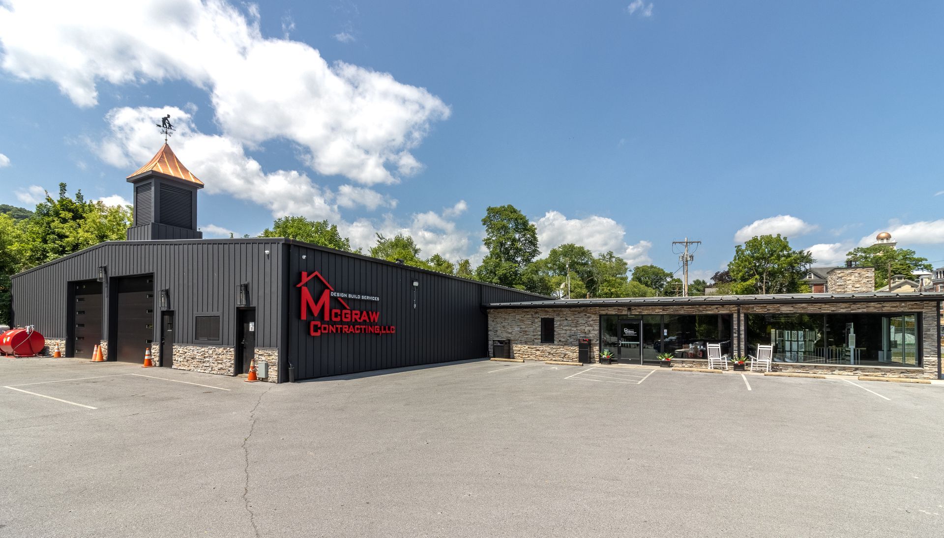 Black building with a red sign reading 