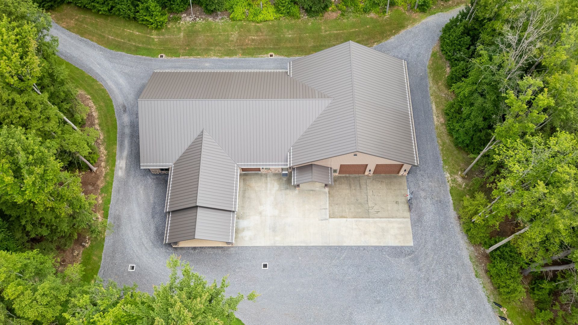Aerial view of Dellulo Garage showcasing full metal roof system in State College.