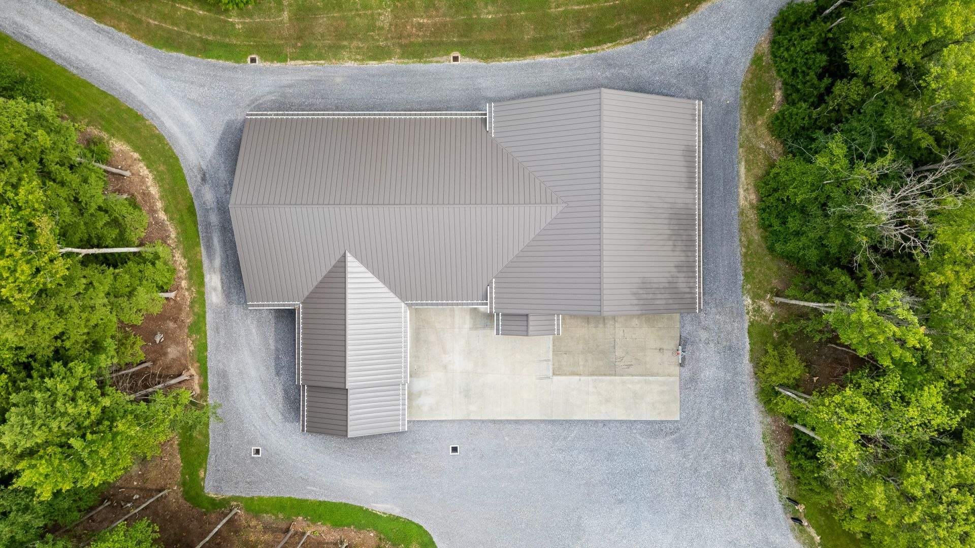 Aerial view of Dellulo Garage showcasing full metal roof structure in State College.