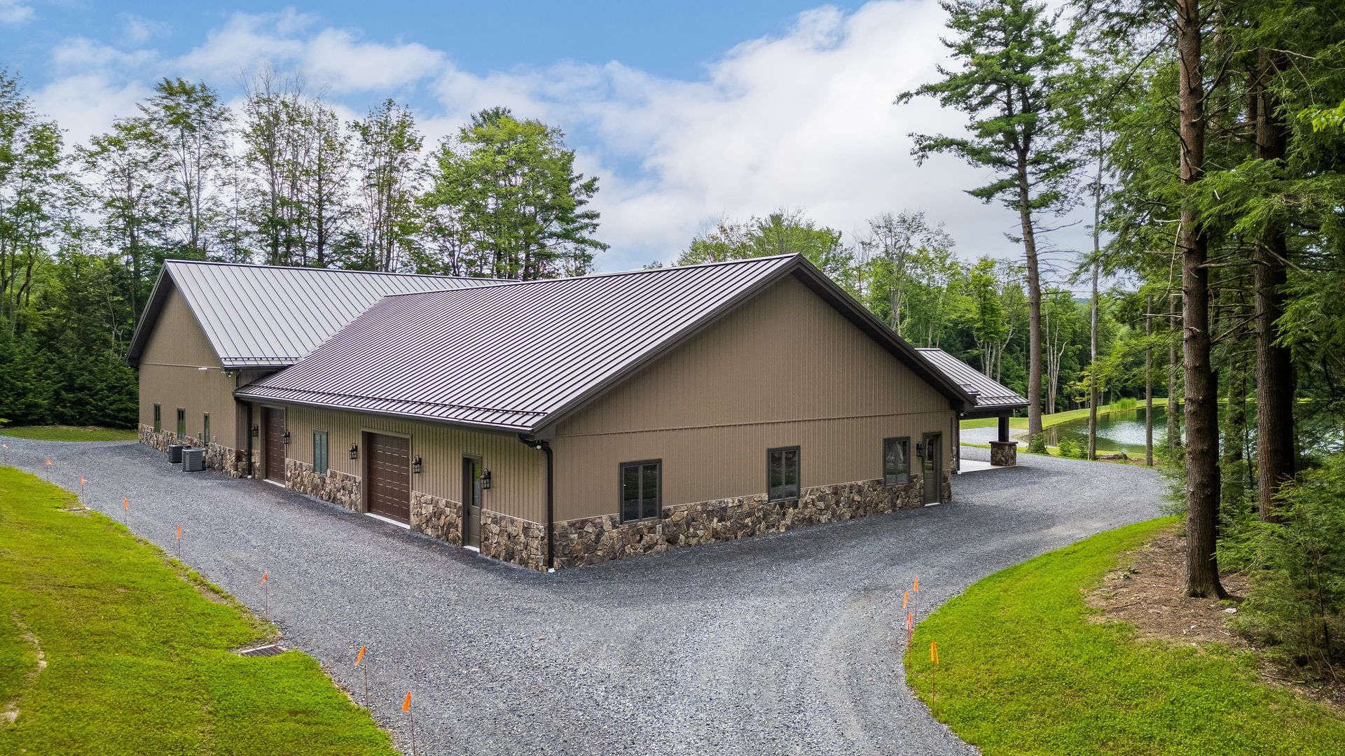 Custom garage building featuring standing seam metal roof in State College.
