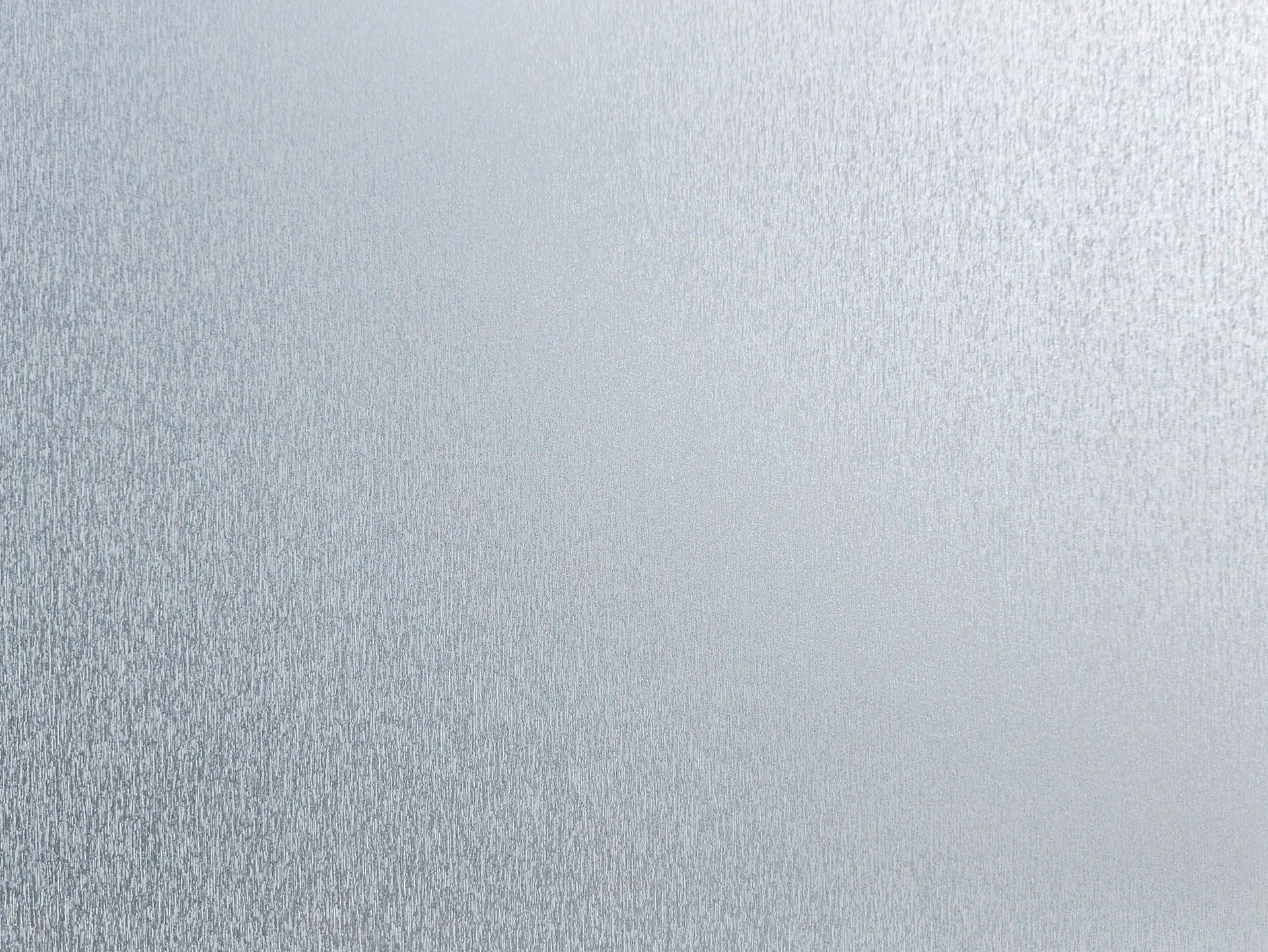 Silver, textured surface.