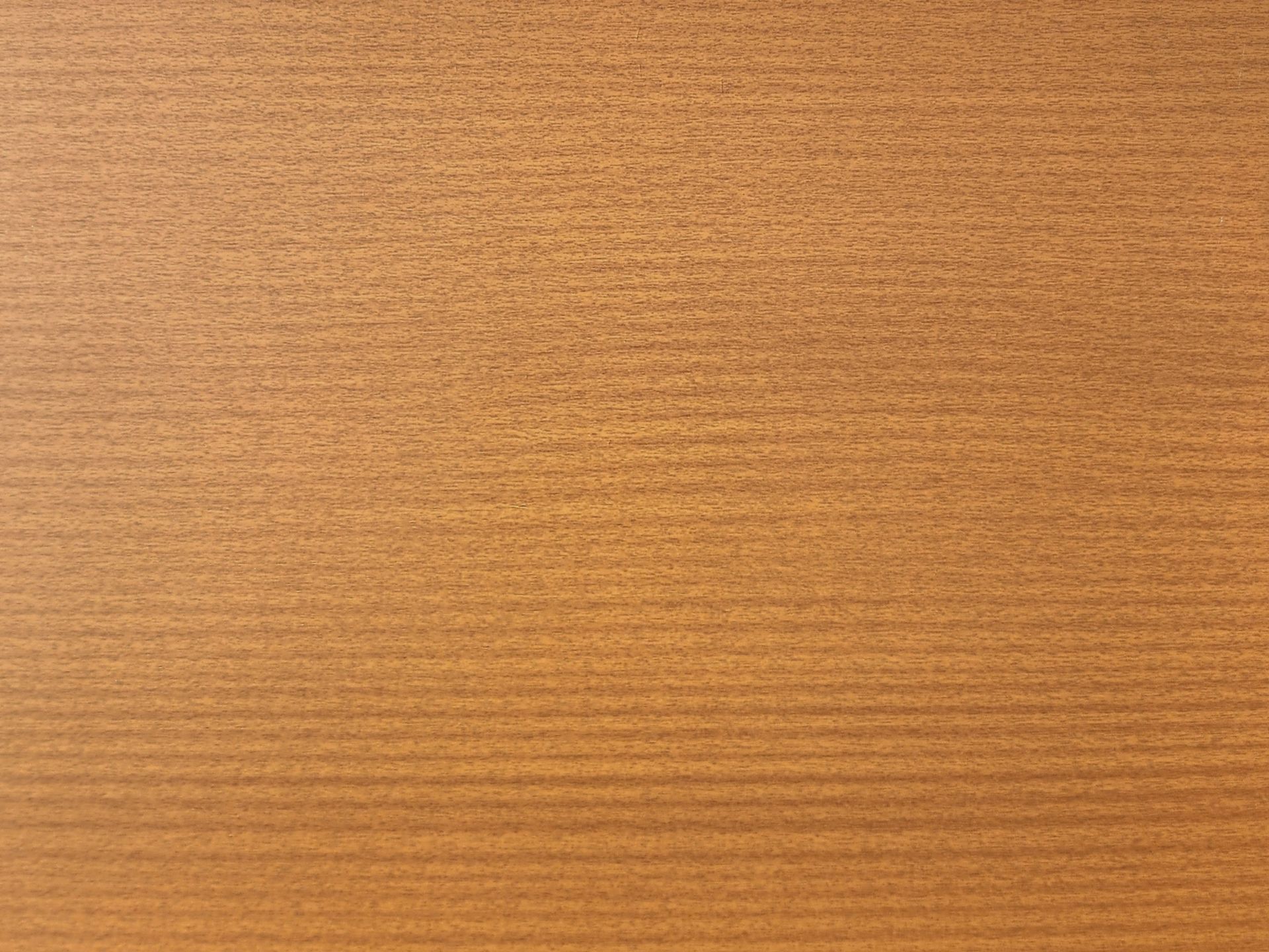 Close-up of a textured, horizontal-striped surface in shades of tan and brown.