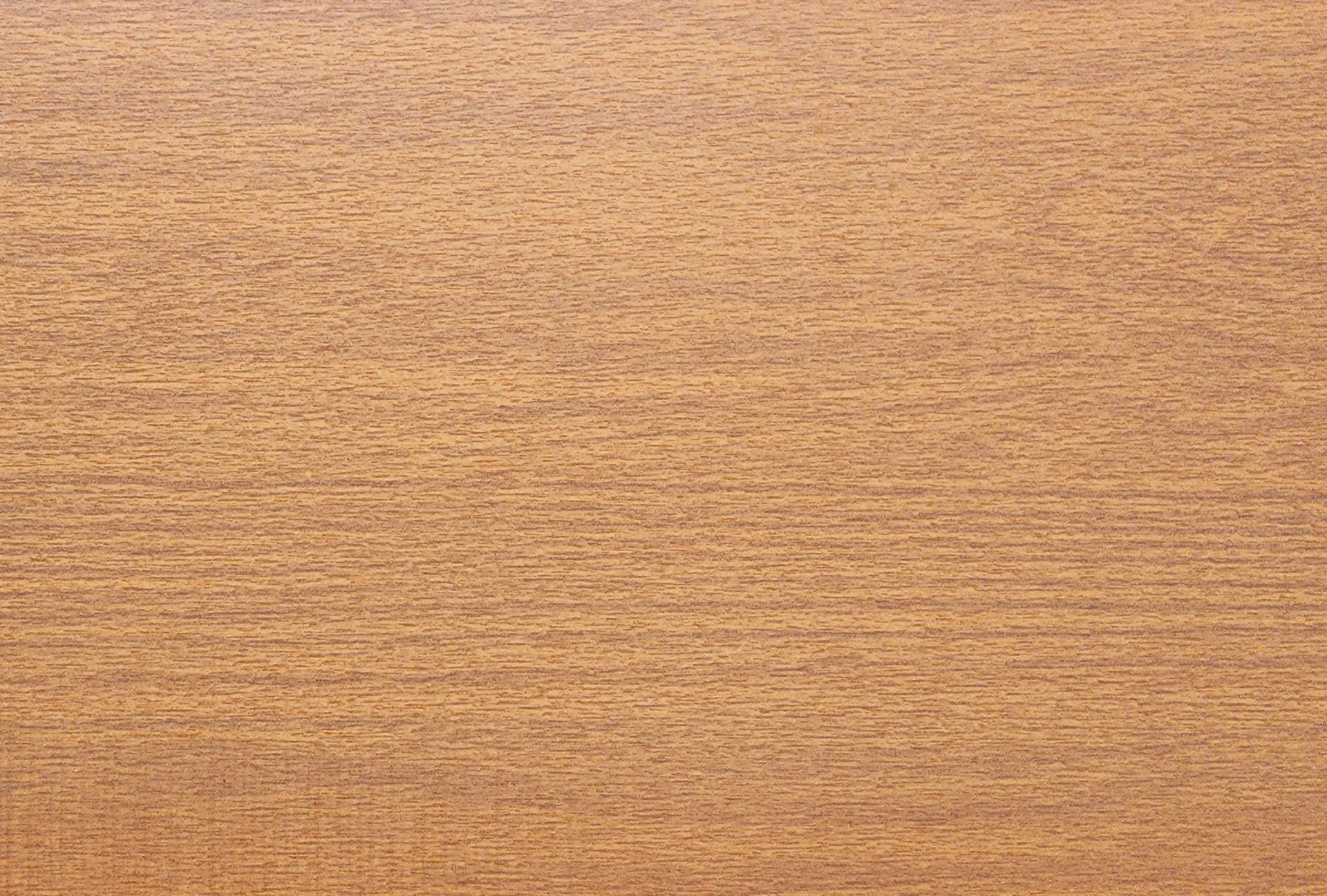 Close-up of a wooden surface with horizontal grain lines in shades of light and medium brown.