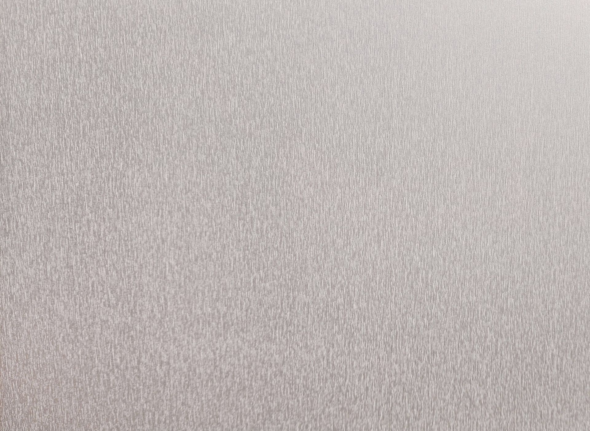 Gray, textured surface, evenly lit.