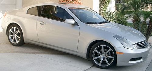 Silver Infiniti G35 coupe parked in a driveway.