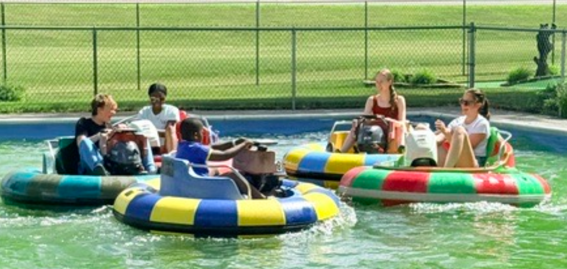 Youth trying out the bumper boats.