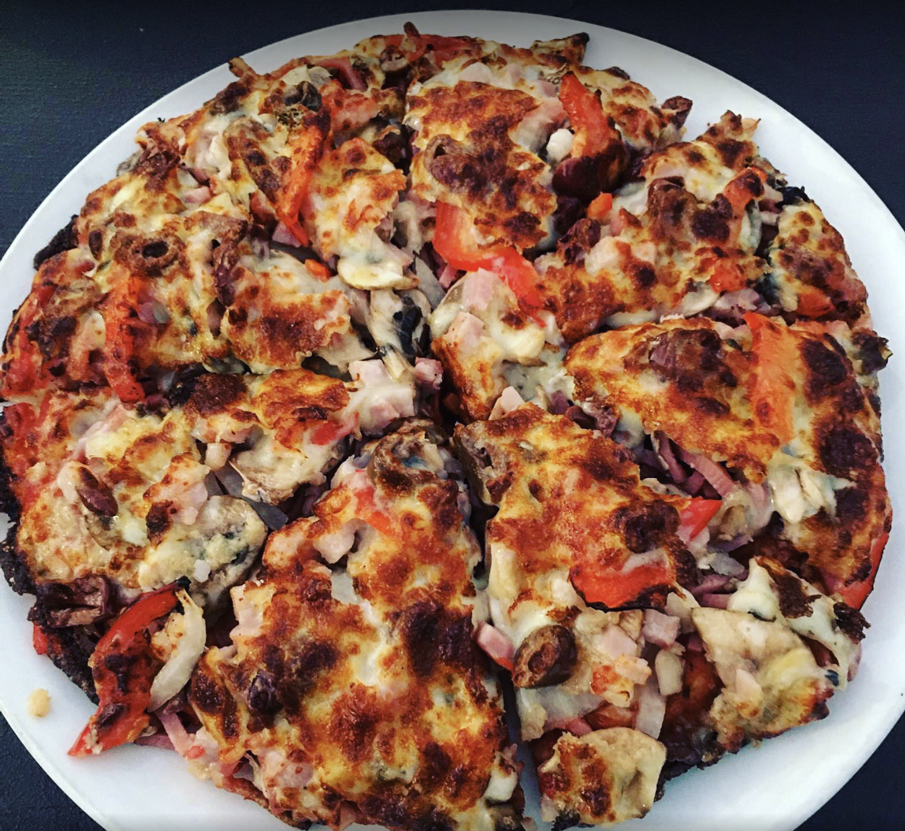 Meaty Pizza Topped with Fresh Herb — Bella M Pizzas in Bundaberg North, QLD