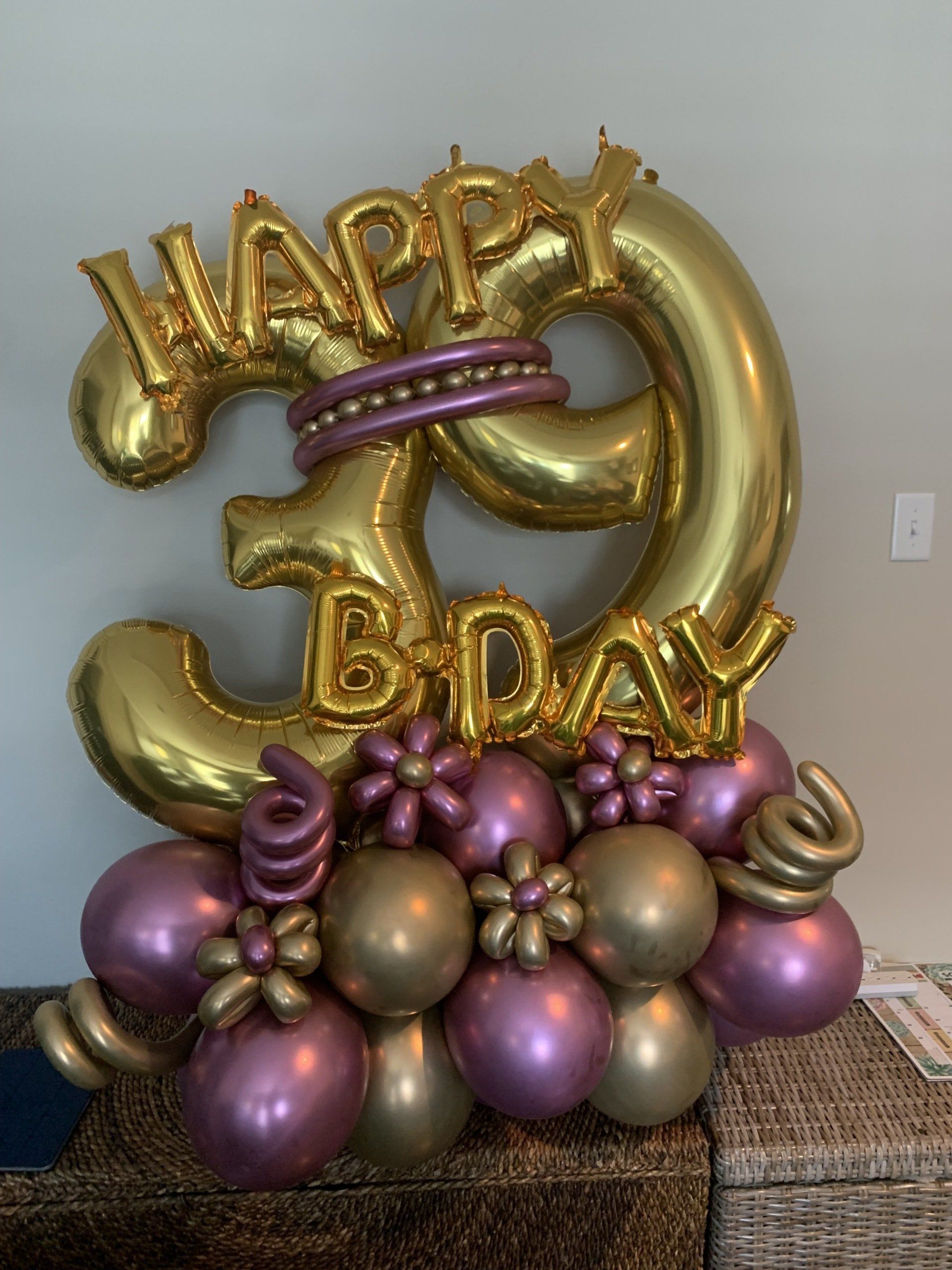 A bunch of balloons are sitting on top of a table.