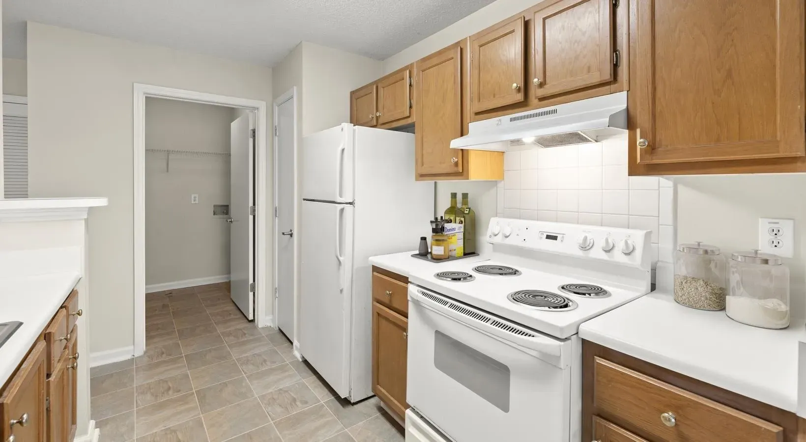 kitchen with white appliances and wood cabinets