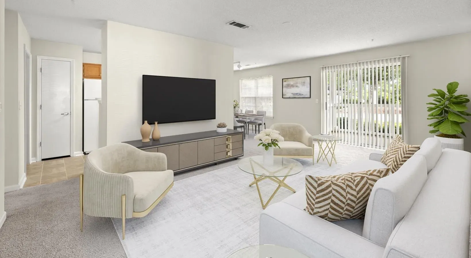 apartment living room with white furniture and tv