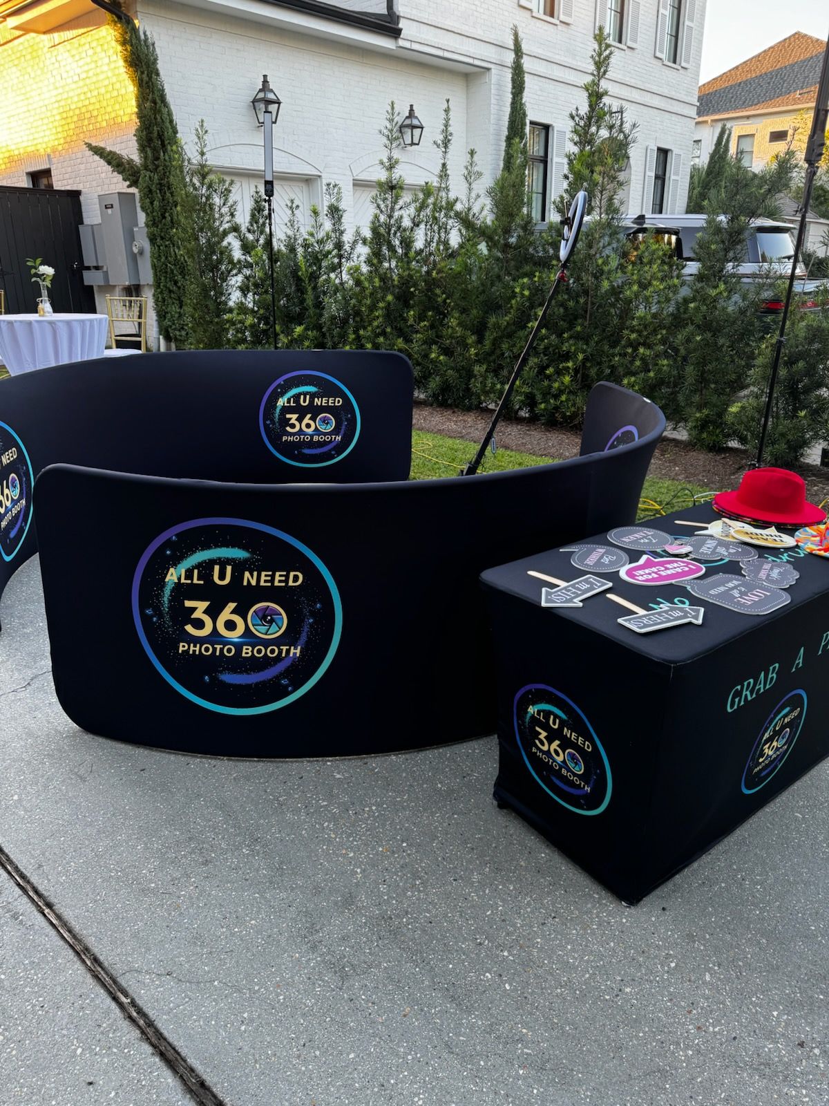 A group of people are standing in front of a wall with confetti falling around them.
