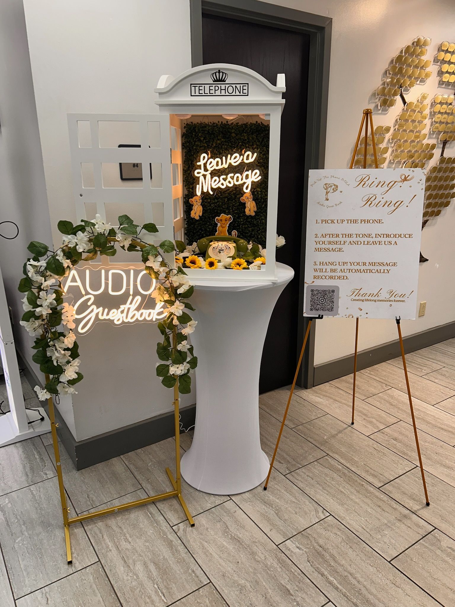 An old black telephone is sitting on a wooden table.