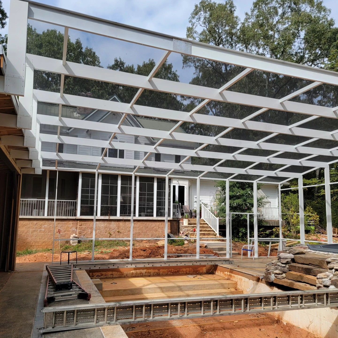 A house under construction with a clear roof