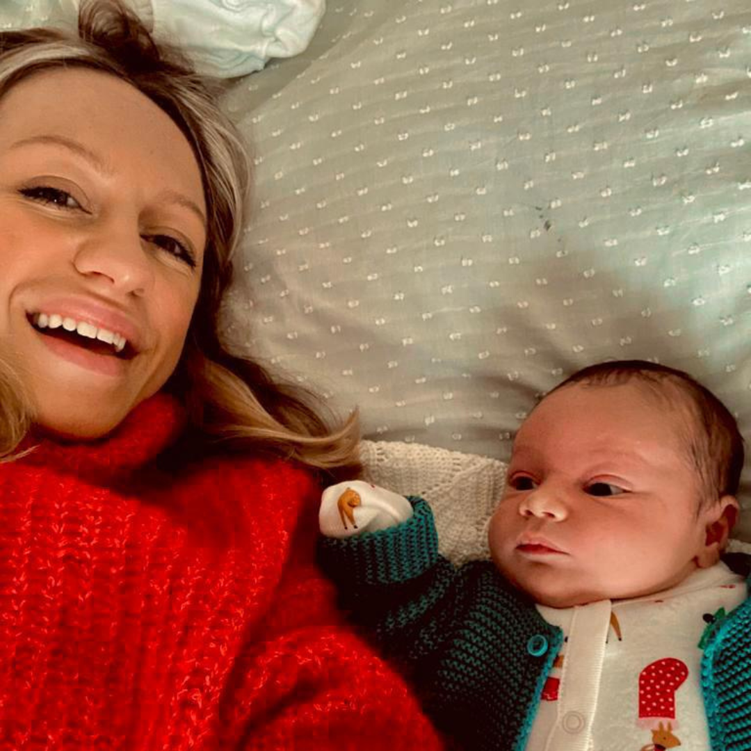 Happy mother and newborn bonding at home after a positive birth