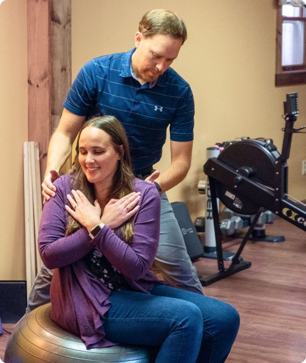 Dan, co-owner of Strong Oaks PT, working with a patient