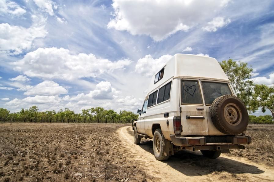 A White Van is Parked on a Dirt Road in a Field — Waring's Auto Electrical in South Geelong, VIC