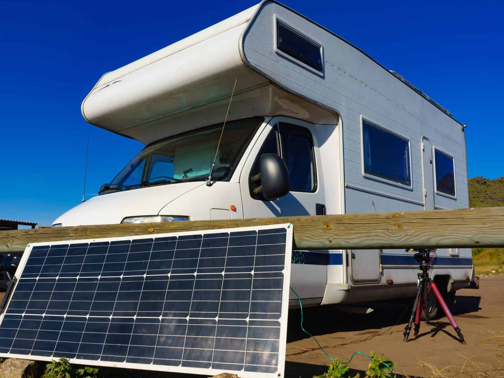 A RV is Parked Next to a Solar Panel — Waring's Auto Electrical in South Geelong, VIC