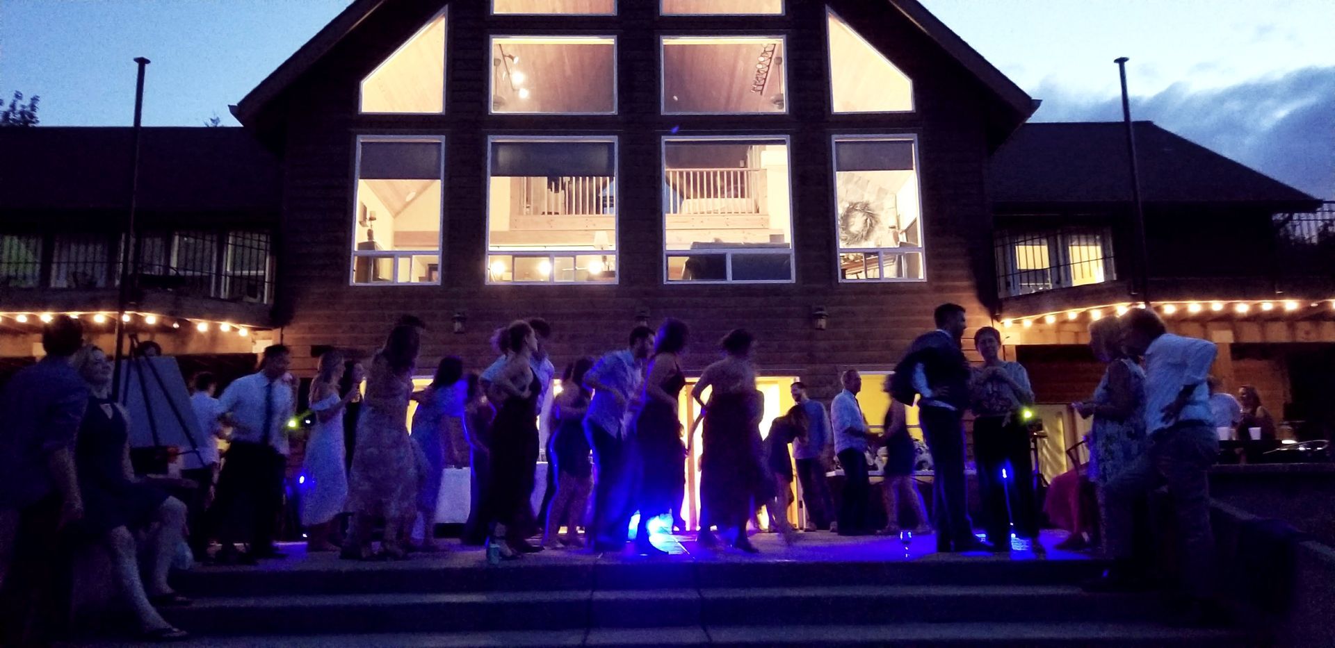 A picture of a packed dance floor during an outdoor wedding reception. Venue: The Inn at Diamond Woods in Monroe, Oregon.