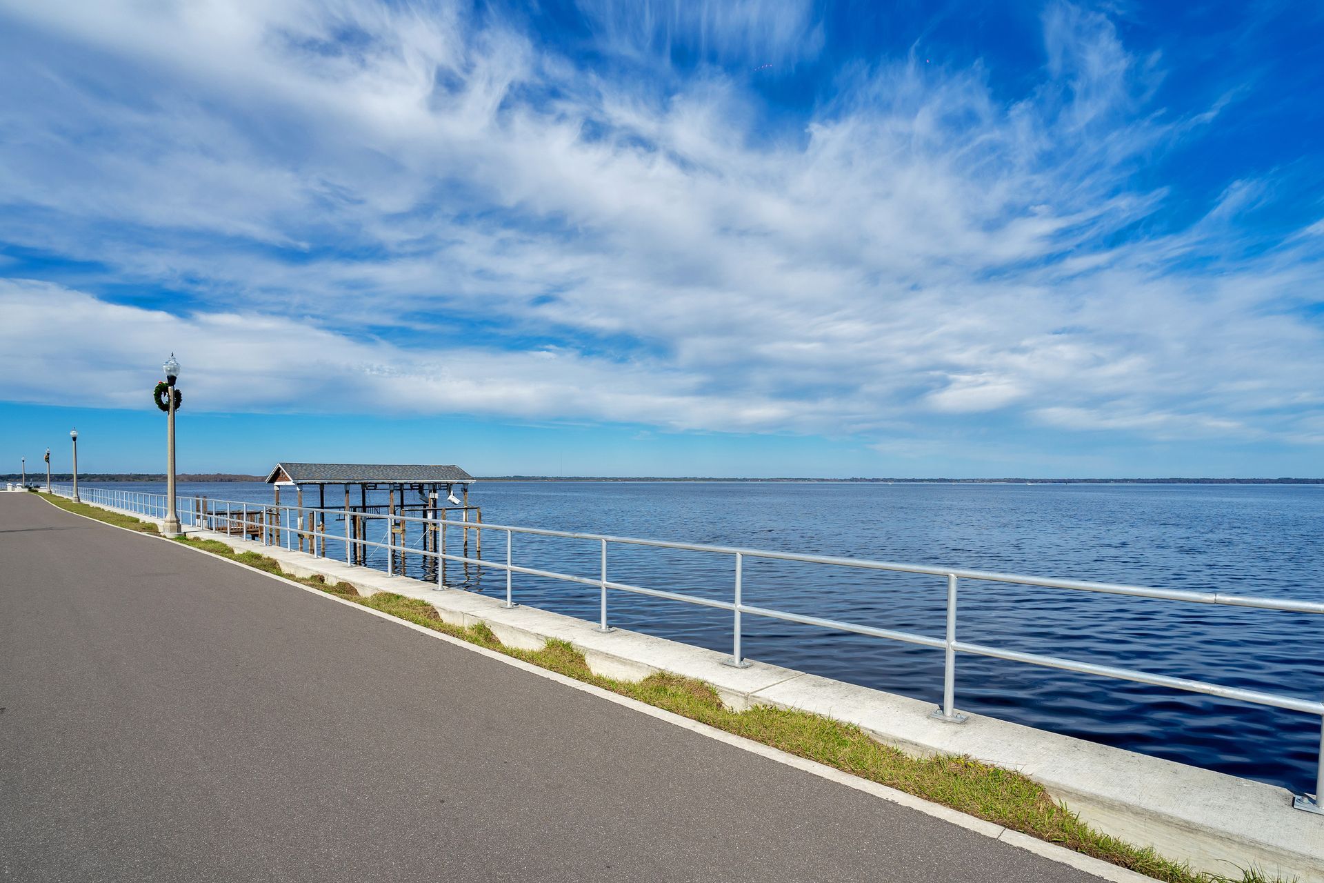 A road that is next to a body of water.