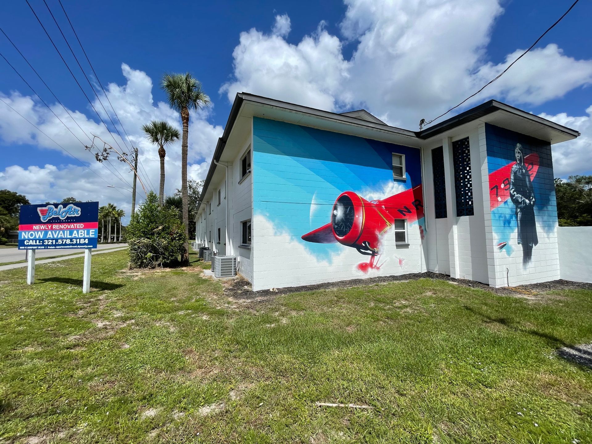 A building with a mural of an airplane on the side of it.