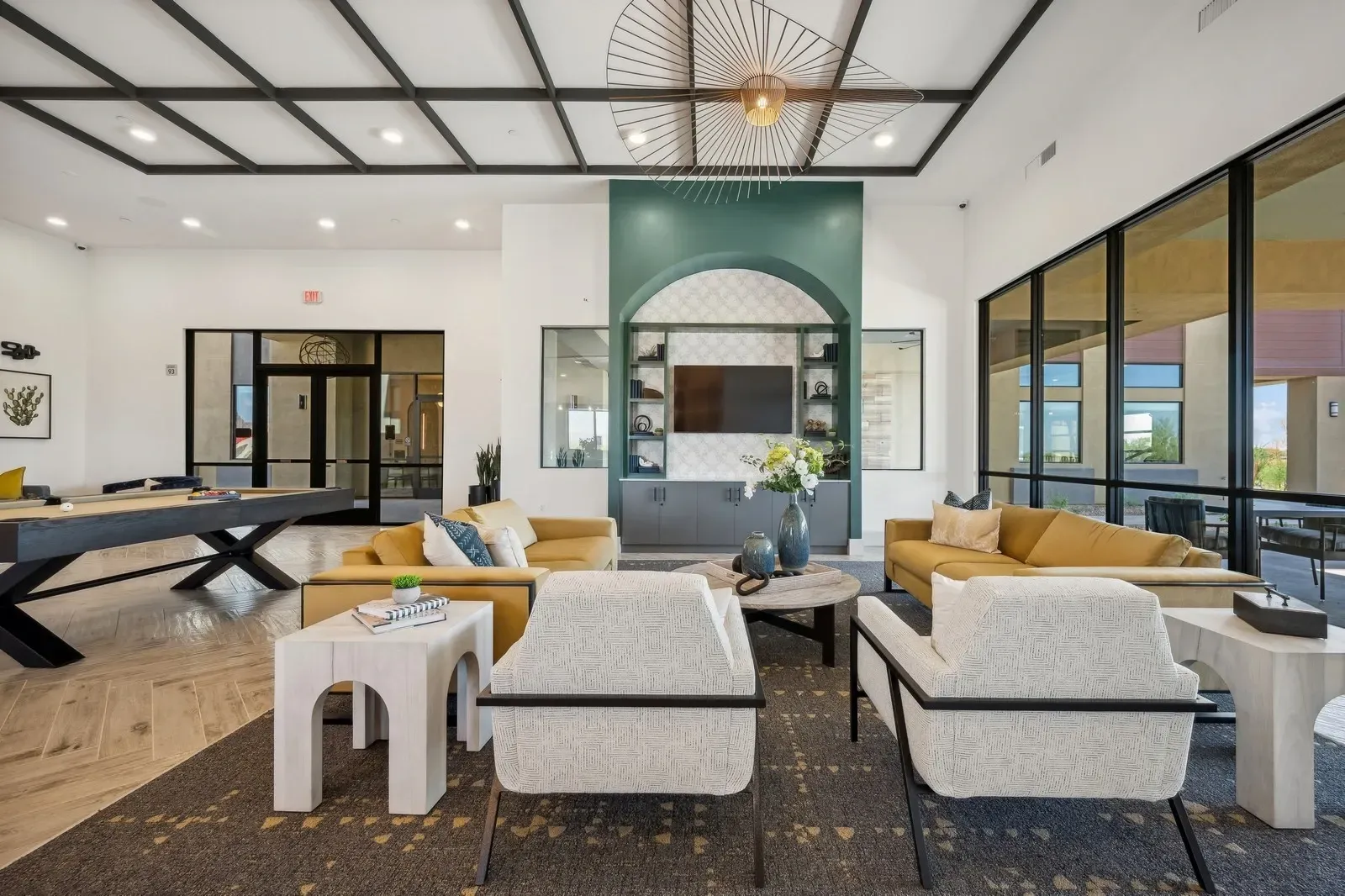 Relax and unwind in our modern resident lounge, complete with a billiard table, cozy seating, and a communal workspace.