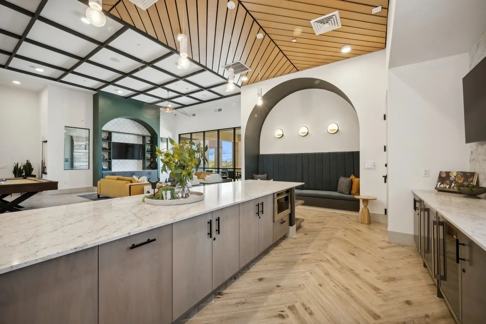 Enjoy our stylish and spacious community lounge, featuring a gourmet kitchen island, cozy seating nooks, and a billiards table for resident entertainment.