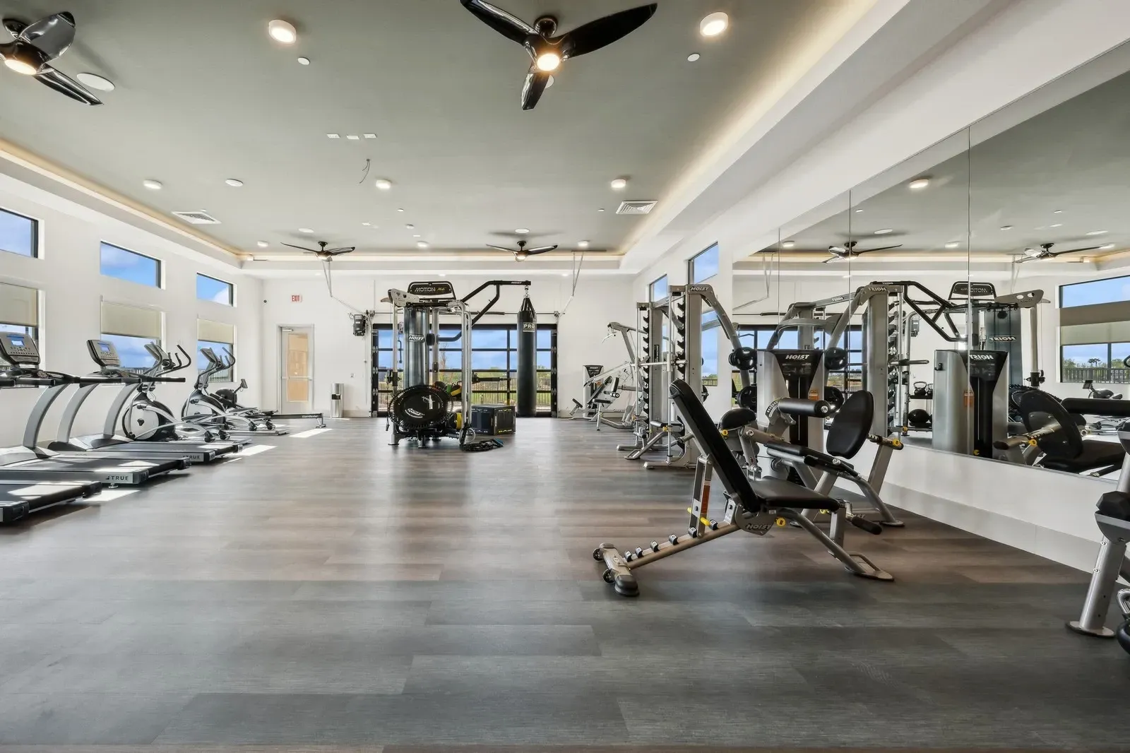 State-of-the-art fitness center equipped with cardio machines, weight-lifting stations, and a boxing area for residents.