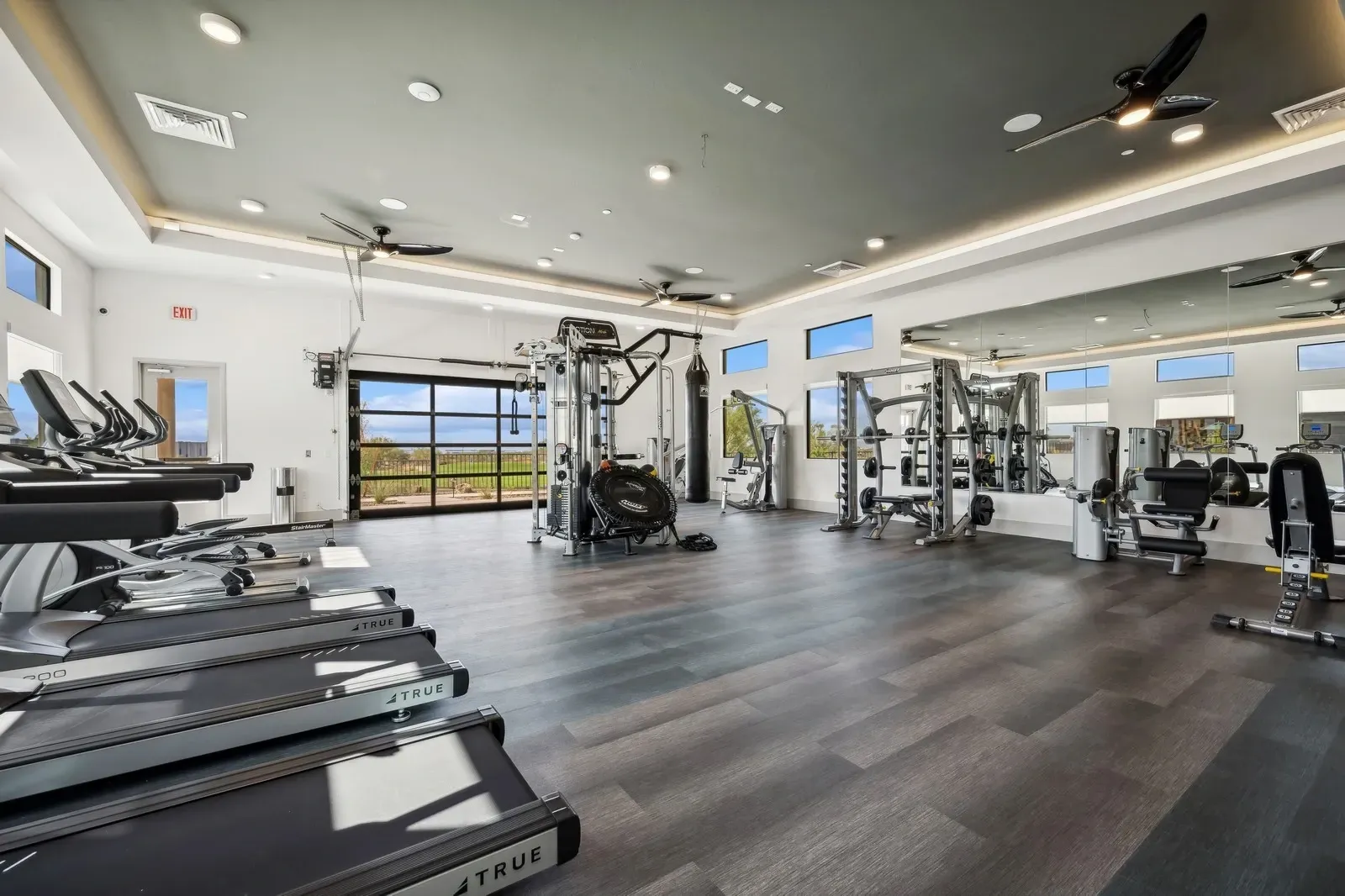 State-of-the-art fitness center featuring cardio equipment, free weights, and weight machines, perfect for your workout needs.
