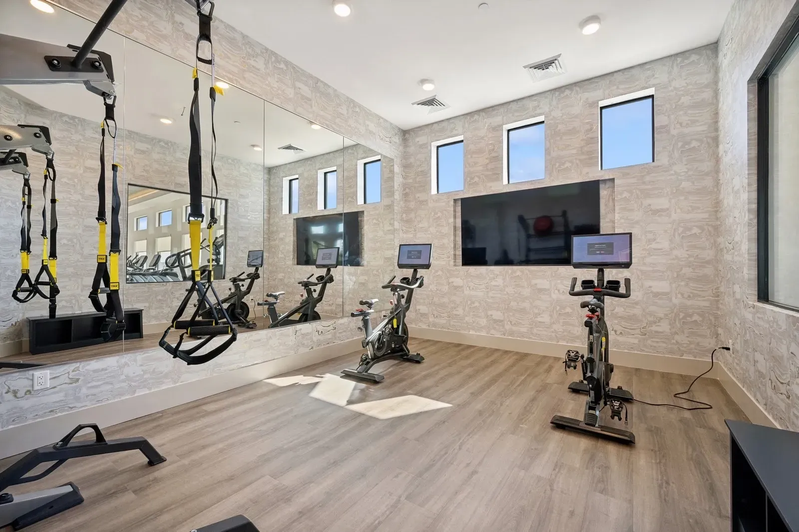 Stay active in our state-of-the-art fitness center, featuring cardio machines, free weights, and TRX suspension trainers for a complete workout.