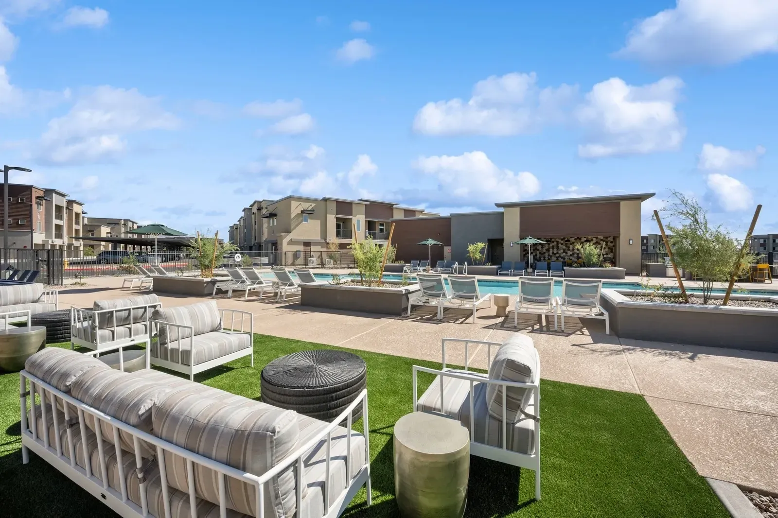 Relax by the sparkling swimming pool and enjoy the comfortable outdoor lounge area, perfect for socializing or unwinding.