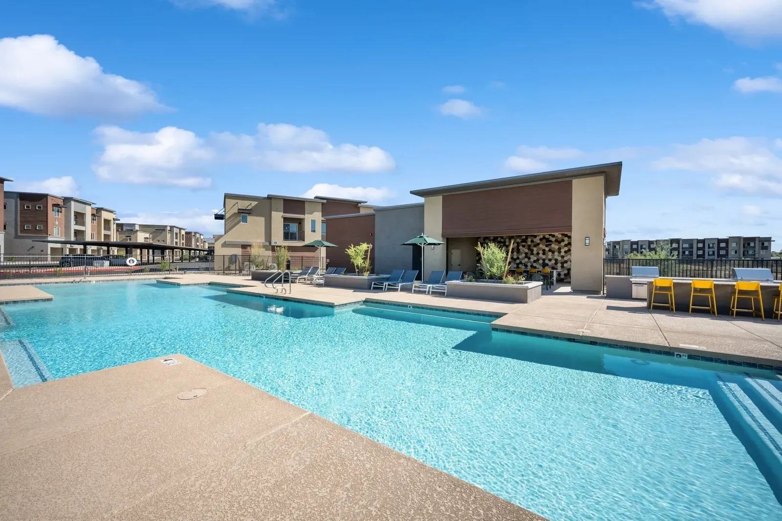 Enjoy our sparkling resort-style swimming pool, perfect for relaxing or entertaining, complete with comfortable lounge chairs and a fully-equipped outdoor kitchen.