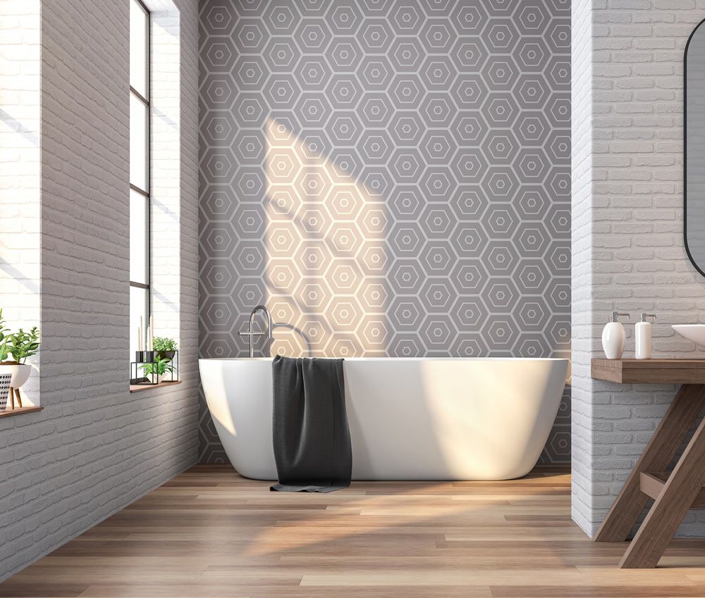 a bathroom with a bathtub , sink , mirror and window .