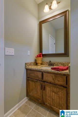 a bathroom with a sink and a mirror in alabama