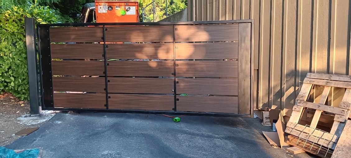 A wooden gate is sitting in front of a building.