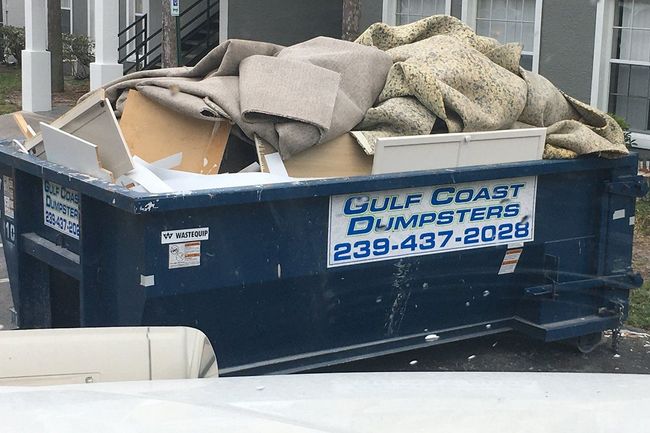 Dumpster Container with Junks — Naples, FL — Gulf Coast Dumpster Services