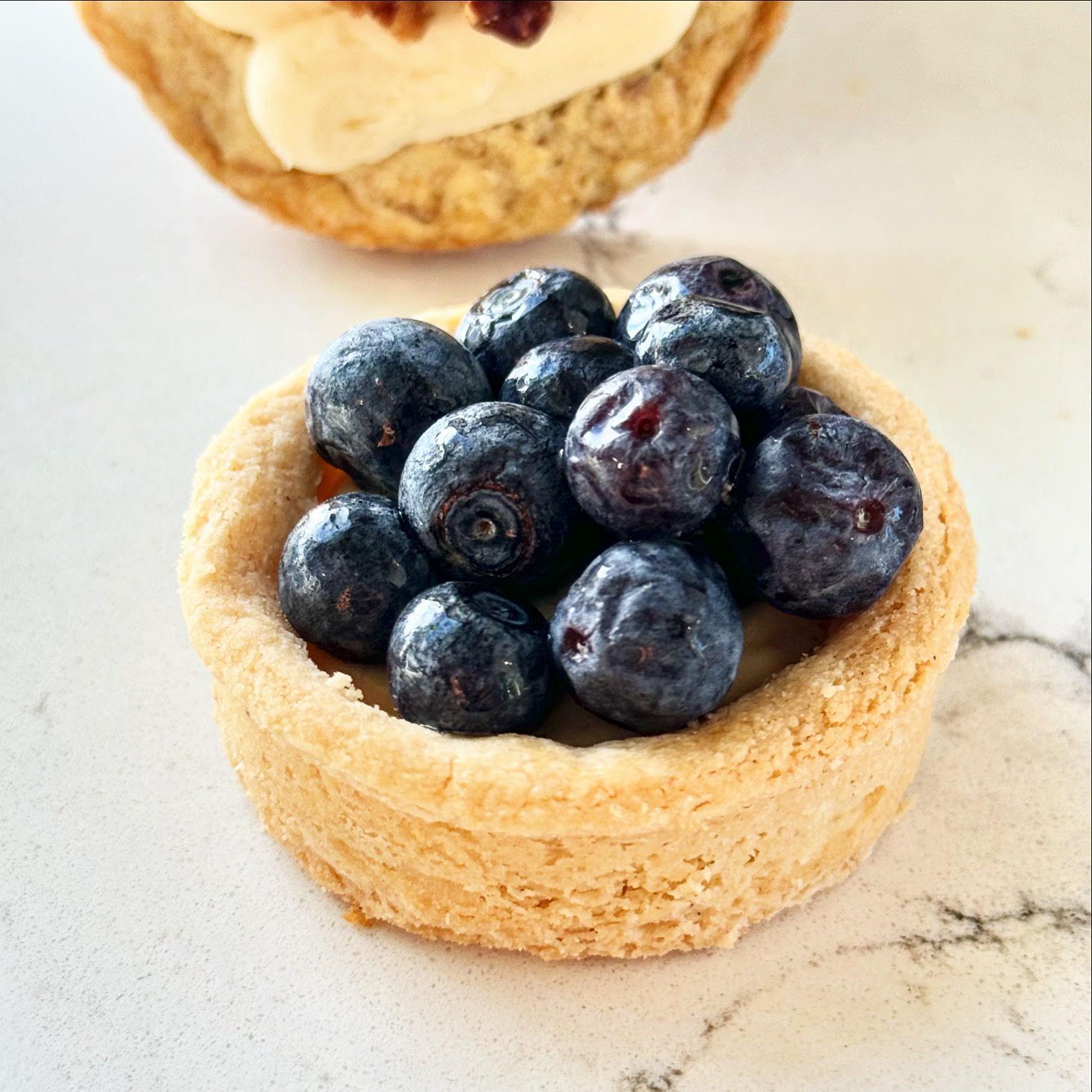 A pastry with blueberries in it on a table
