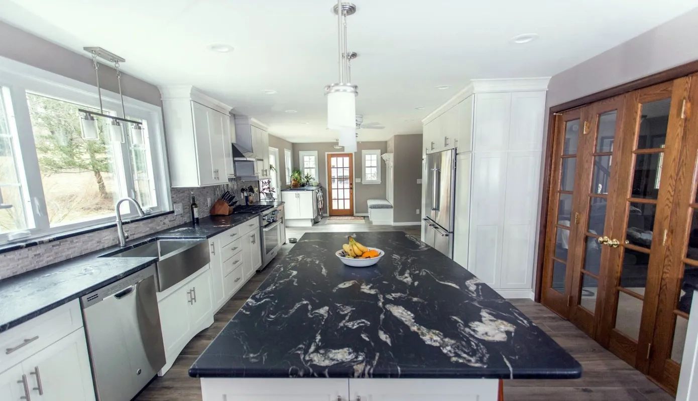 A large island in the middle of the kitchen.