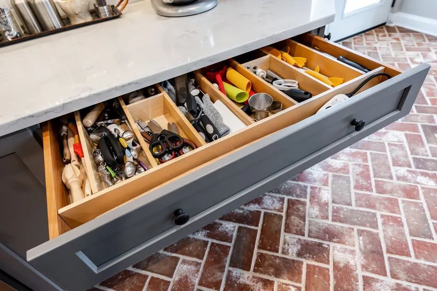 A kitchen drawer filled with lots of utensils and tools.