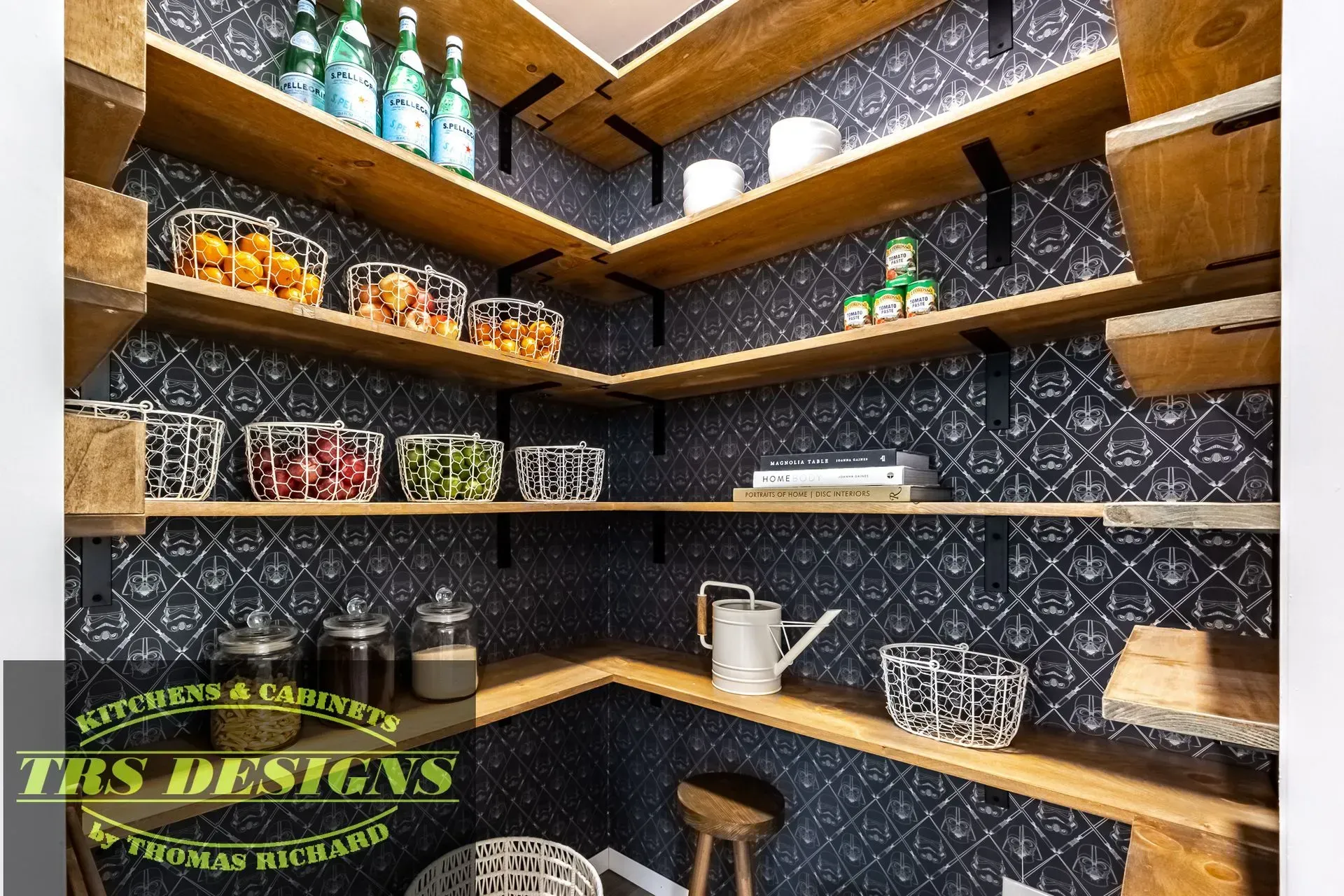 A pantry with wooden shelves filled with jars and cans.