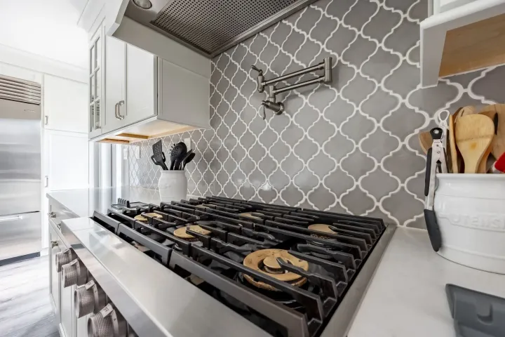 A stove top oven is sitting on top of a counter in a kitchen.