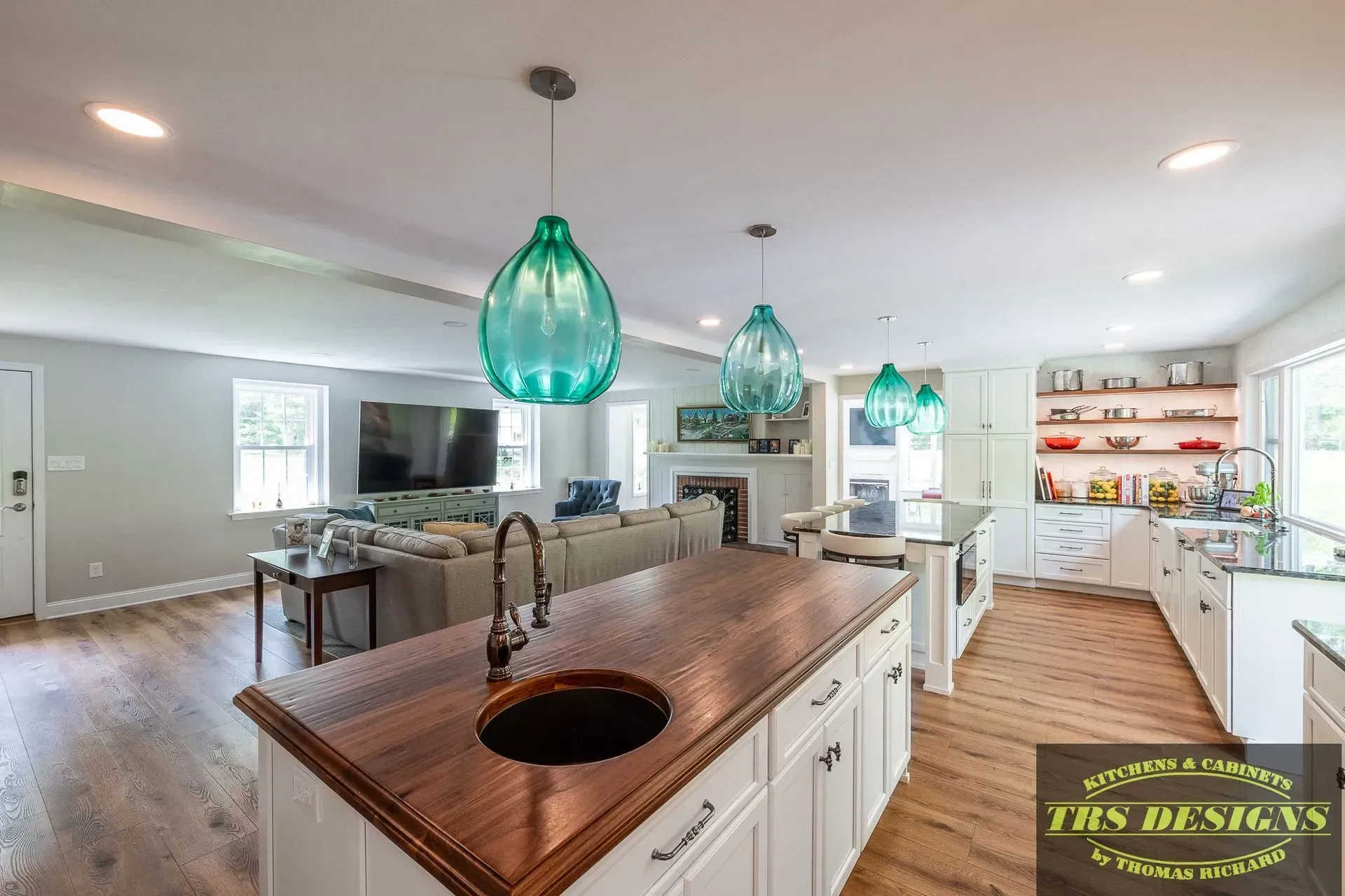 A kitchen with a large island in the middle of the room.