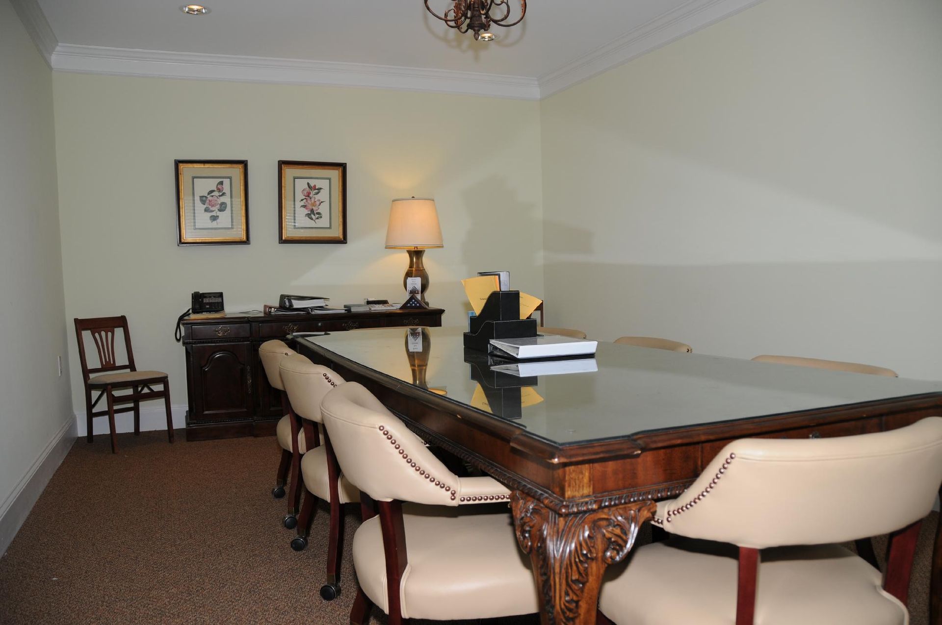 A conference room with a long table and chairs