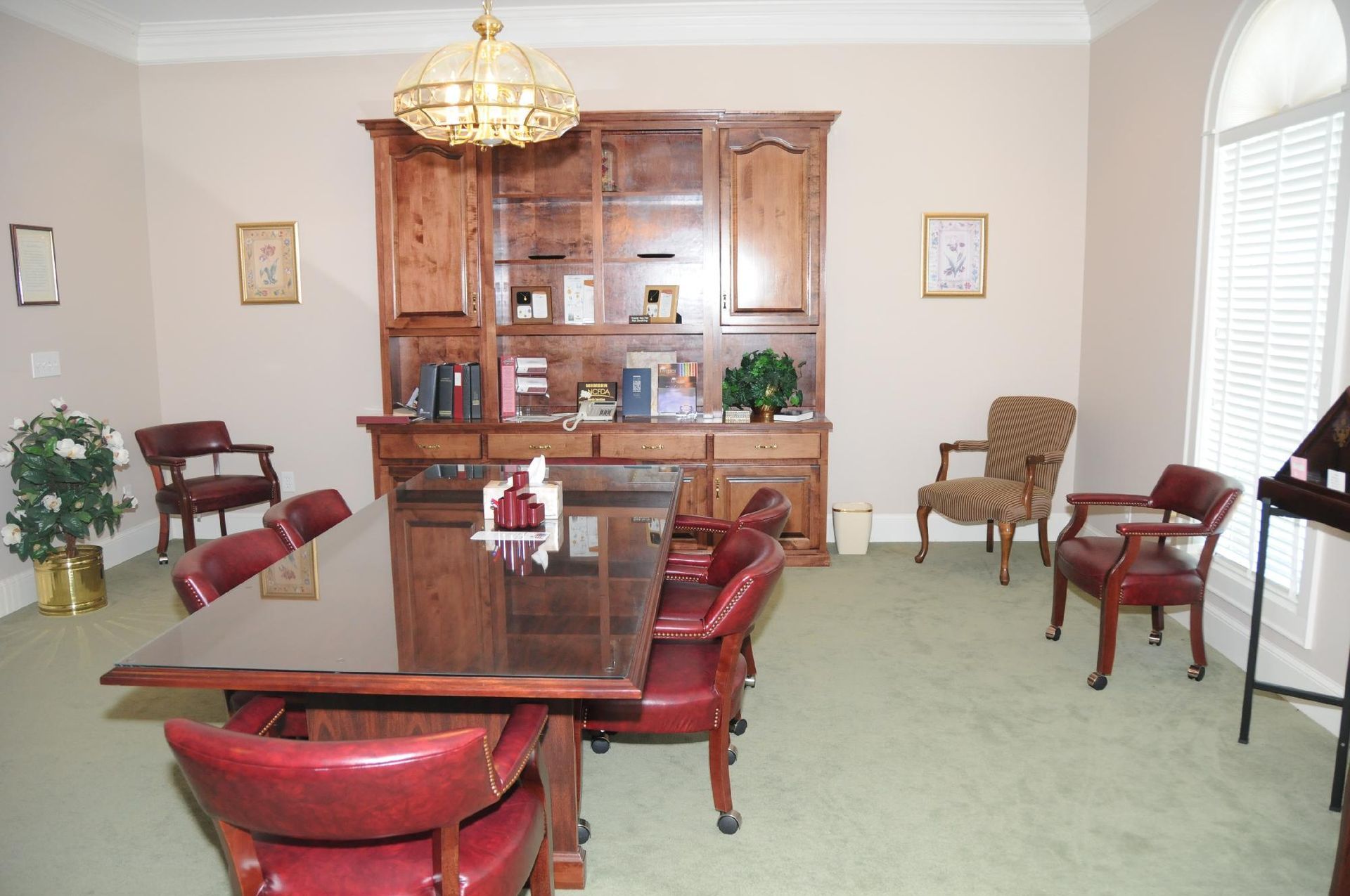 A room with a table and chairs in it