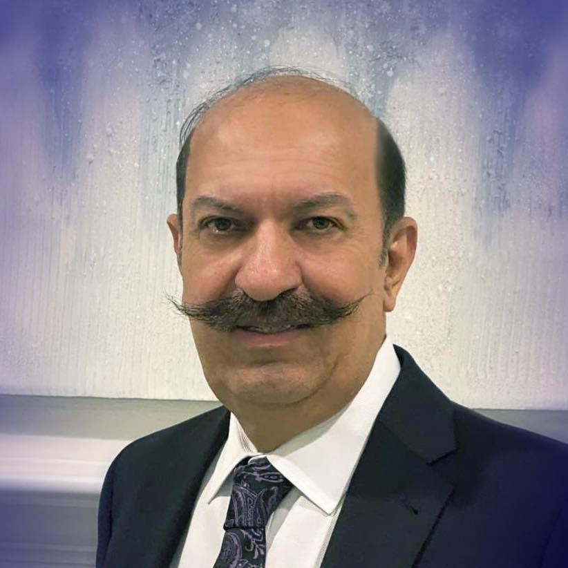 a bald man with a mustache is wearing a suit and tie .