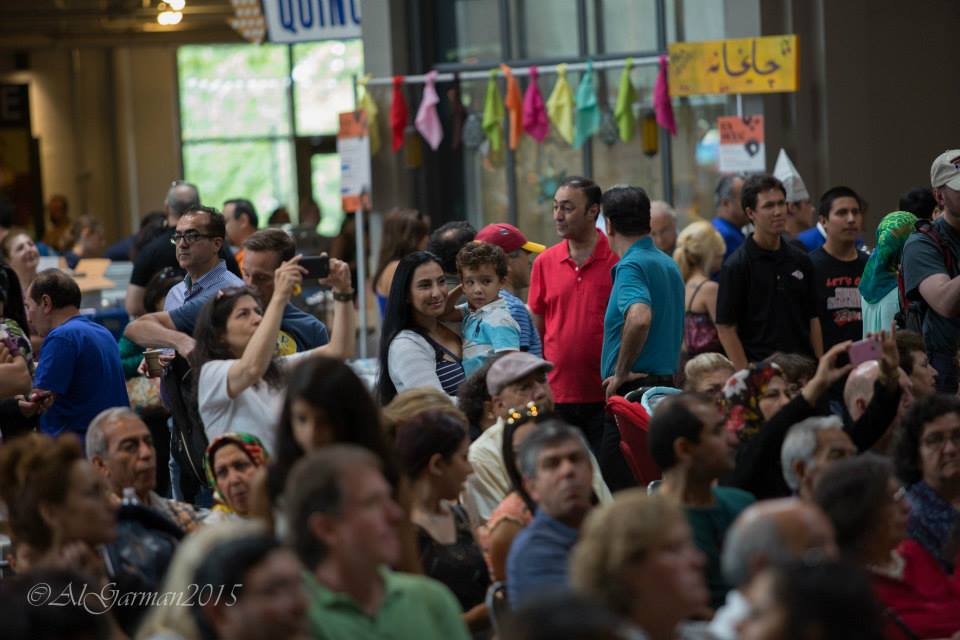 A large group of people are sitting in a room.